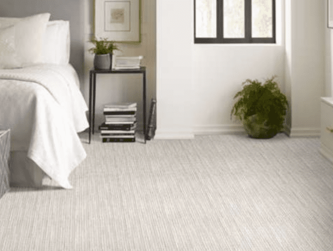 A bedroom with white walls and floors.