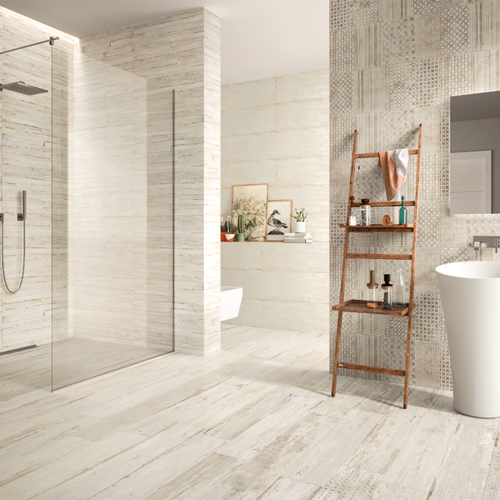 A bathroom with a shower, toilet and sink.