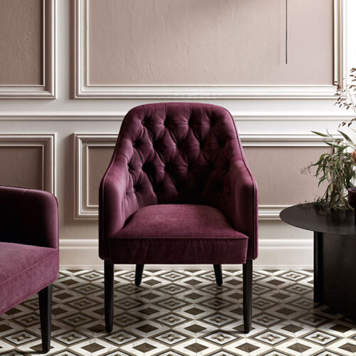 A purple chair and table in a room.