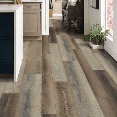 A kitchen with wood floors and a counter.